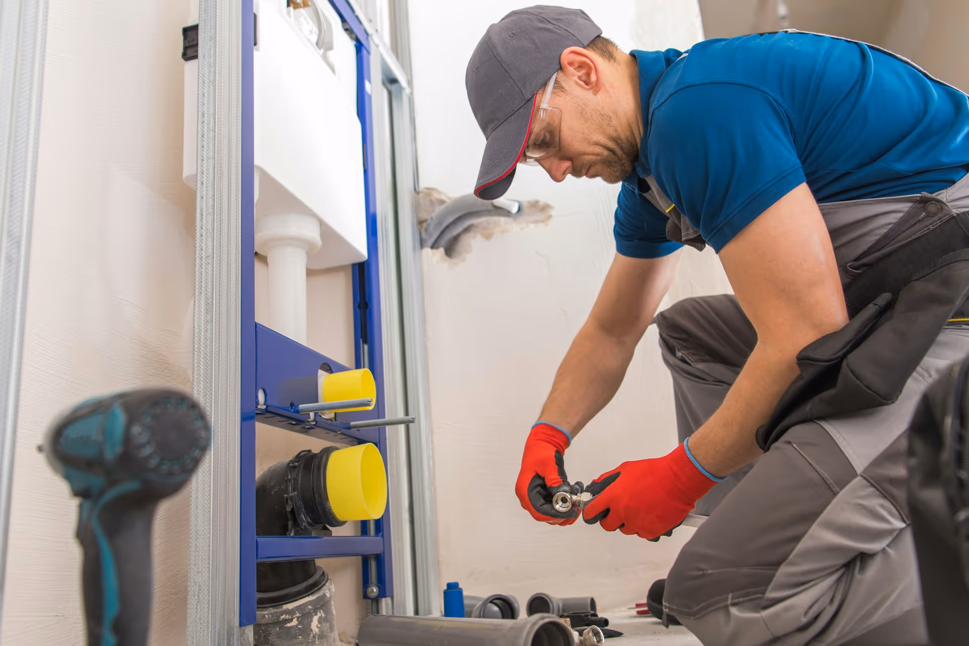 Plumber working on pipe repair.